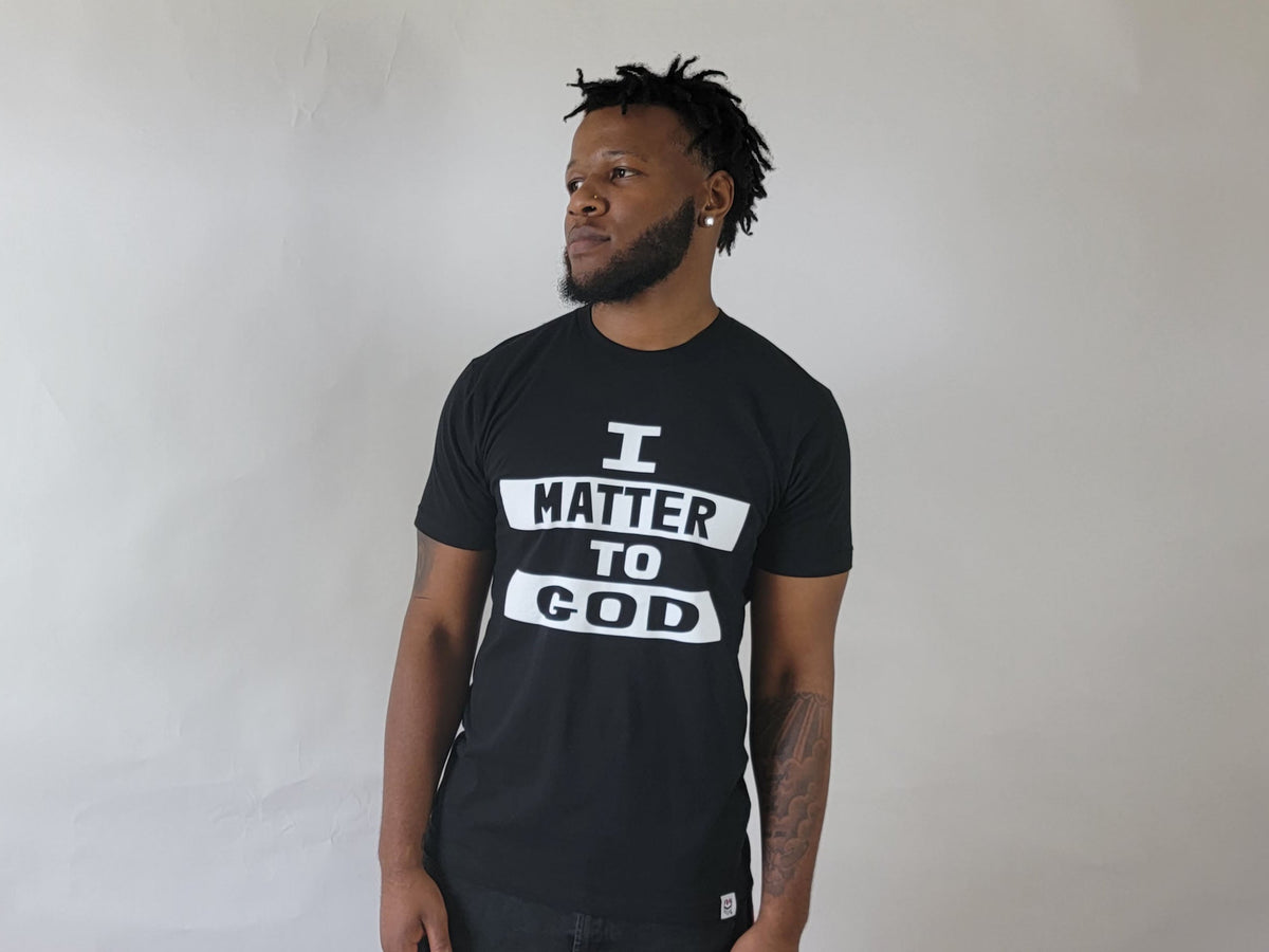Male model wearing black I Matter to God Christian T-shirt, front view