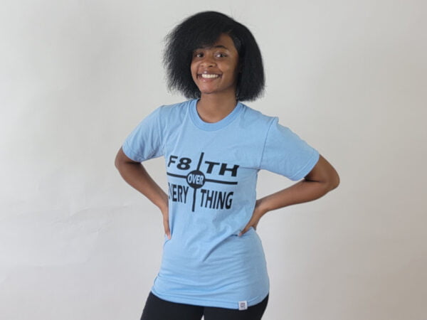 woman in light blue "f8th over everything" tee